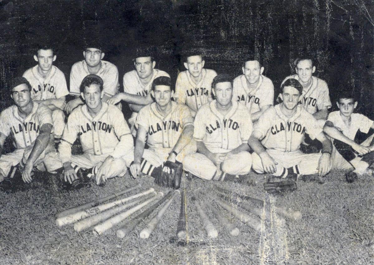 Black and white photo of twelve young men dressed in baseball uniforms that say &quot;CLAYTON&quot; in large capital letters across their chests.