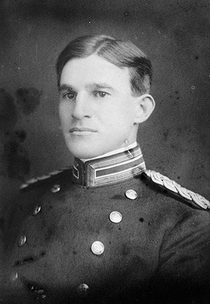 Ferguson. He is younger, and wearing military formals.