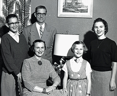 "Judge Robert C. Finley and family." Photograph. 1958. Susan Parish Photograph Collection, 1889-1990. Washington State Archives. Finley's family. He is left-back, son flanked left. In front of him is his wife. To wife's right are two daughters, about 10 and 20. All are smiling.