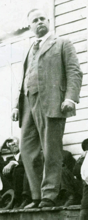 A photograph of Thomas Contee &quot;Tam&quot; Bowie at the Clifton Post Office in Ashe County. Image from the Ashe County Public Library.
