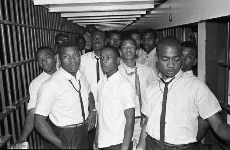 A jail cell crowded with black men