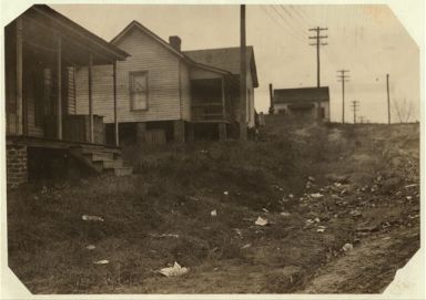 Some of the housing conditions of the workers in the Cannon Mills to contrast with the homes and gardens some times shown from the &quot;show mills&quot; of the state, 1912. Image courtesy of Library of Congress. 