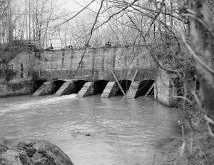 &quot;View looking west at Sluice Gates at dam from north bank of Deep River- Lockville Hydroelectric Plant, Deep River, 3.5 miles upstream from Haw River, Moncure, Chatham County, NC.&quot; Image courtesy of Library of Congress; call #: HAER NC,19-MONC,1--6. 