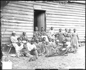 &quot;Contrabands&quot; at Foller's House, Cumberland Landing, Virginia.  Photograph, May 14, 1862 by James F. Gibson.  Civil War Glass Negatives and Related Prints, Library of Congress. 
