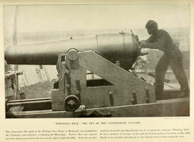 &quot;Whistling Dick,&quot; a large cannon. It is being operated by a man roughly half its size.