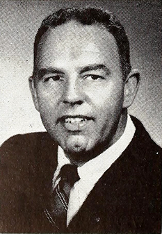 A photograph of radio broadcaster James William &quot;Jim&quot; Reid published in 1957. Image from the Internet Archive.