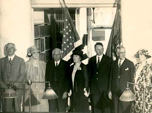 &quot;A rare photograph with Bessie Alderman, taken at a reception in the Rotunda. Left to right: President Edwin A. Alderman, Mrs. Bessie Alderman, Secretary of State Frank B. Kellogg and Mrs. Kellogg, Governor Harry Flood Byrd, Dean Charles G. Maphis, and Mrs. Maphis. Photo by Frank Mitchell.&quot; Courtesy of UVA Special Collections.
