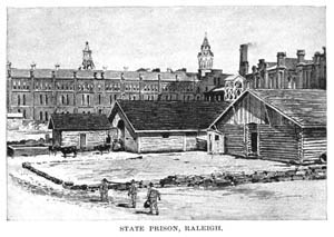 A large building in the background. Small people in the foreground walk towards the building.