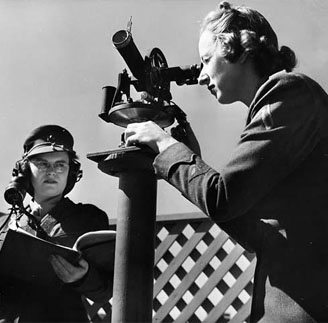 women looking in telescope
